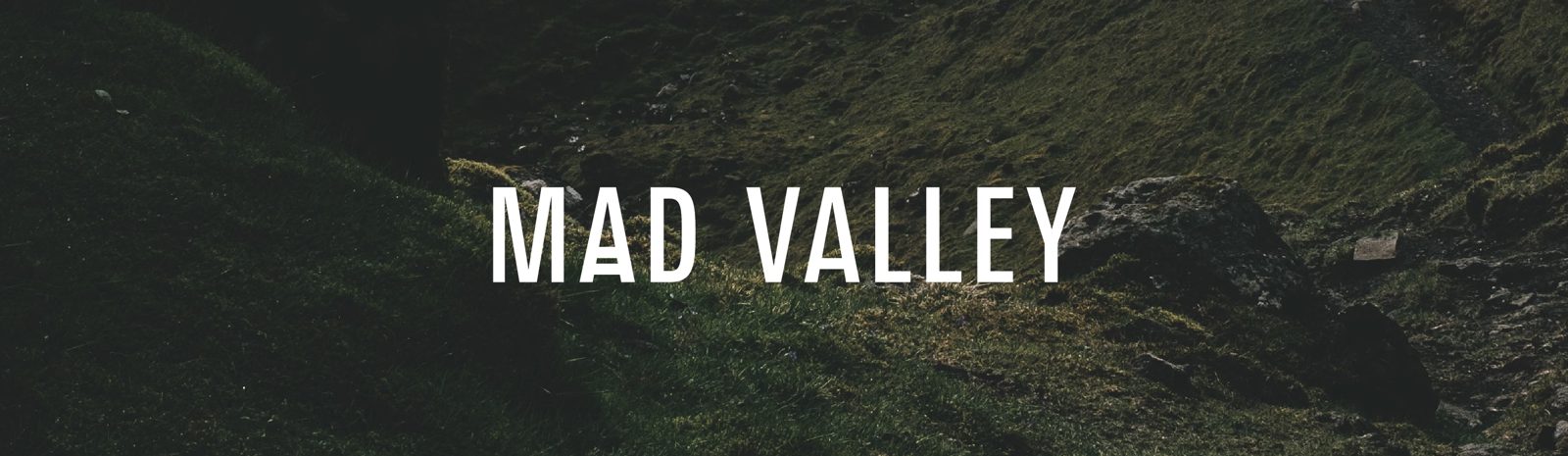 Mad Valley artwork — dark green valley